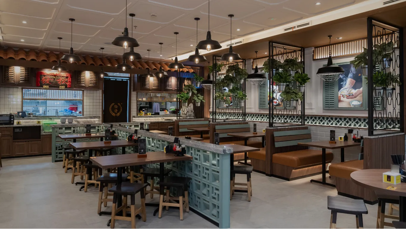Song Fa restaurant interior with green divider walls and pendant lighting