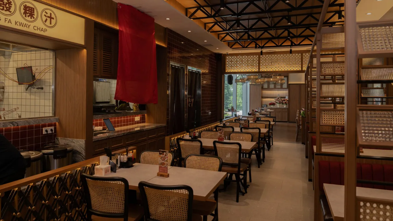 Song Fa Kway Chap restaurant dining room with wood and rattan finishes