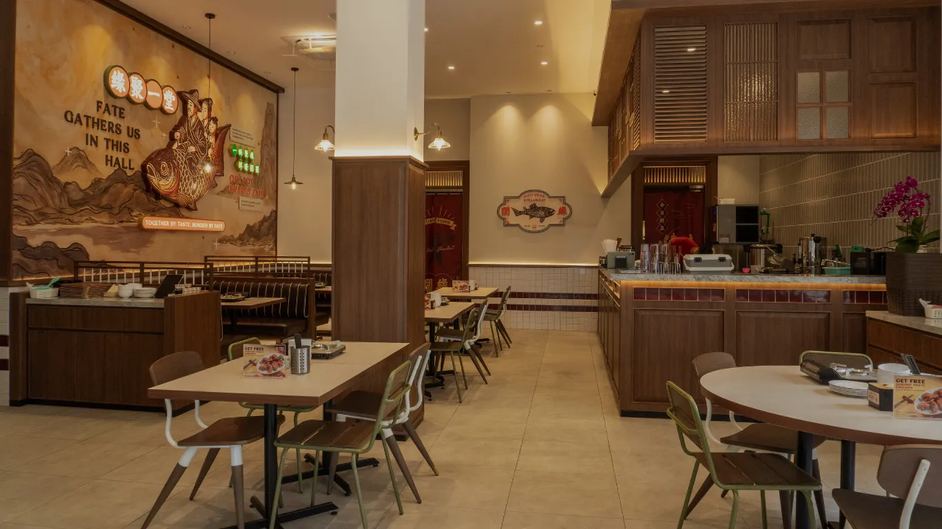 Tuan Yuan restaurant interior with wood paneling and mural artwork